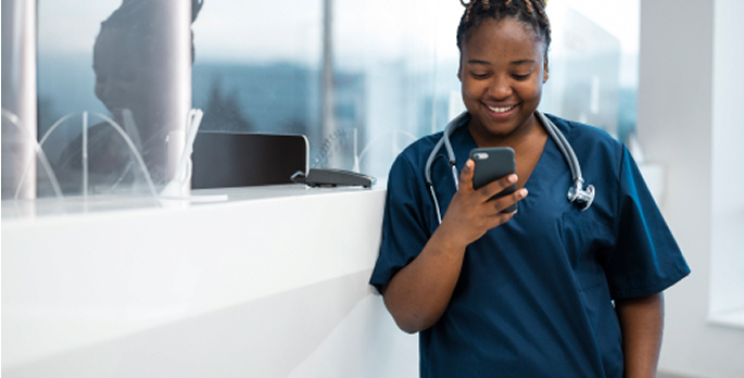 Nurse looking at phone